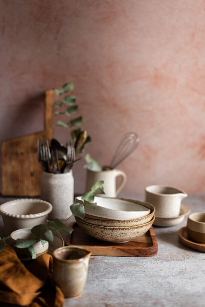 Various ceramic bowls and kitchen utensils arranged decoratively.